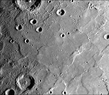 This image, from NASA Mariner 10 spacecraft which launched in 1974, shows young craters superposed on smooth plains. Larger young craters have central peaks, flat floors, terraced walls, and radial ejecta deposits.