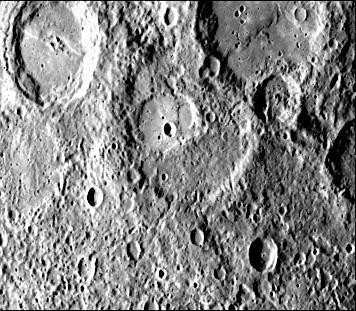 This image, from NASA Mariner 10 spacecraft which launched in 1974, shows several scarps, which appear to be confined to crater floors. The scarp in the crater at the upper left of the image has been diverted by the central peaks.