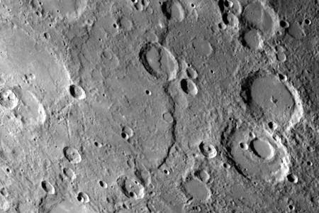 One of the most prominent lobate scarps Discovery Scarp, photographed by NASA Mariner 10 during it first encounter with Mercury, is located at the center of this image extending from the top to near bottom. 