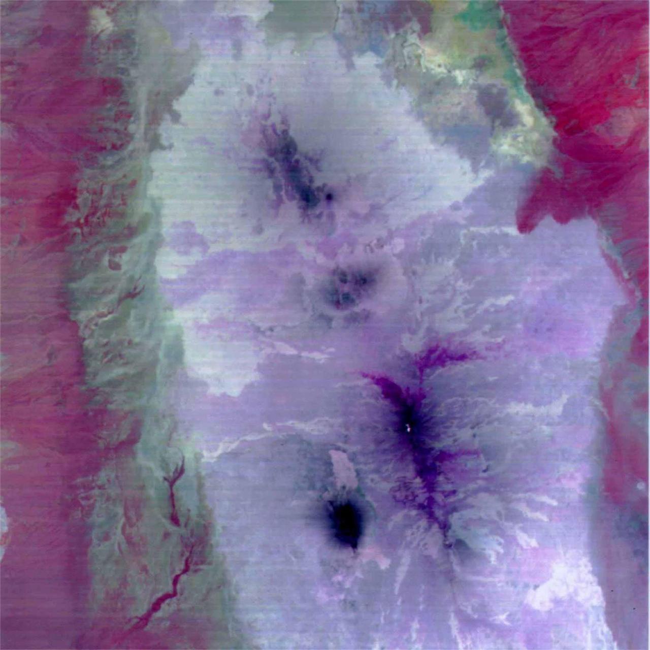 This image is a color composite covering the Rift Valley inland area of Ethiopia (south of the region shown in PIA02452). The color difference of this image reflects the distribution of different rocks with different amounts of silicon dioxide. It is inferred that the area with whitish color is covered with basalt and the pinkish area in the center contain sandesite. This is the first spaceborne, multi-band TIR image in history that enables geologists to distinguish between rocks with similar compositions. The size of image: 60 km x 60 km approx., ground resolution 90 m x 90 m approximately. http://photojournal.jpl.nasa.gov/catalog/PIA02453