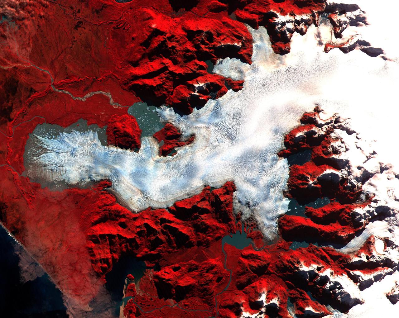 This ASTER image was acquired on May 2, 2000 over the North Patagonia Ice Sheet, Chile near latitude 47 degrees south, longitude 73 degrees west. The image covers 36 x 30 km. The false color composite displays vegetation in red. The image dramatically shows a single large glacier, covered with crevasses. A semi-circular terminal moraine indicates that the glacier was once more extensive than at present. ASTER data are being acquired over hundreds of glaciers worldwide to measure their changes over time. Since glaciers are sensitive indicators of warming or cooling, this program can provide global data set critical to understand climate change.  This image is located at 46.5 degrees south latitude and 73.9 degrees west longitude.   http://photojournal.jpl.nasa.gov/catalog/PIA02670