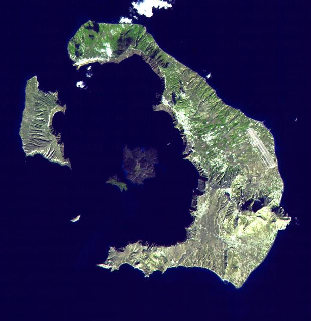 This ASTER image of Santorini was acquired on November 21, 2000 and covers an area of 18 by 18 km. The eruption of Santorini in 1650 B.C. was one of the largest in the last 10,000 years. About 30 cubic kilometers of magma was erupted, forming a plinian column 36 km high. The removal of such a large volume of magma caused the volcano to collapse, producing a caldera. Ash fell over a large area of the eastern Mediterranean. The eruption probably caused the end of the Minoan civilization on the island of Crete. The largest island is Thera, and the smaller is Therasia. The Kameni Islands (dark in the image center) formed after the caldera., with the most recent eruptions occurring in 1950.  The image is centered at 36.4 degrees north latitude, 25.4 degrees east longitude.  http://photojournal.jpl.nasa.gov/catalog/PIA02673