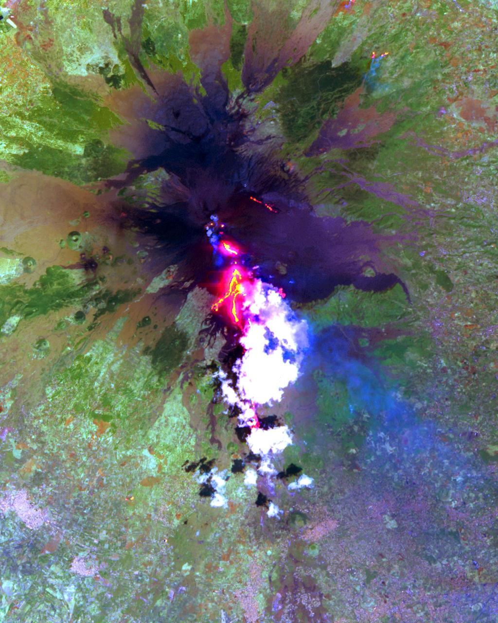 The current eruption of Mt. Etna started on July 17, and has continued to the present. This ASTER image was acquired on Sunday, July 29 and shows advancing lava flows on the southern flank of Mt. Etna above the town of Nicolosi, which is potentially threatened if the eruption increases in magnitude. Also visible are glowing summit craters above the main lava flows, and a small fissure eruption. The bright puffy clouds were formed from water vapor released during the eruption. The image covers an area of 24 x 30 km. The image is centered at 37.7 degrees north latitude, 15 degrees east longitude. http://photojournal.jpl.nasa.gov/catalog/PIA02677