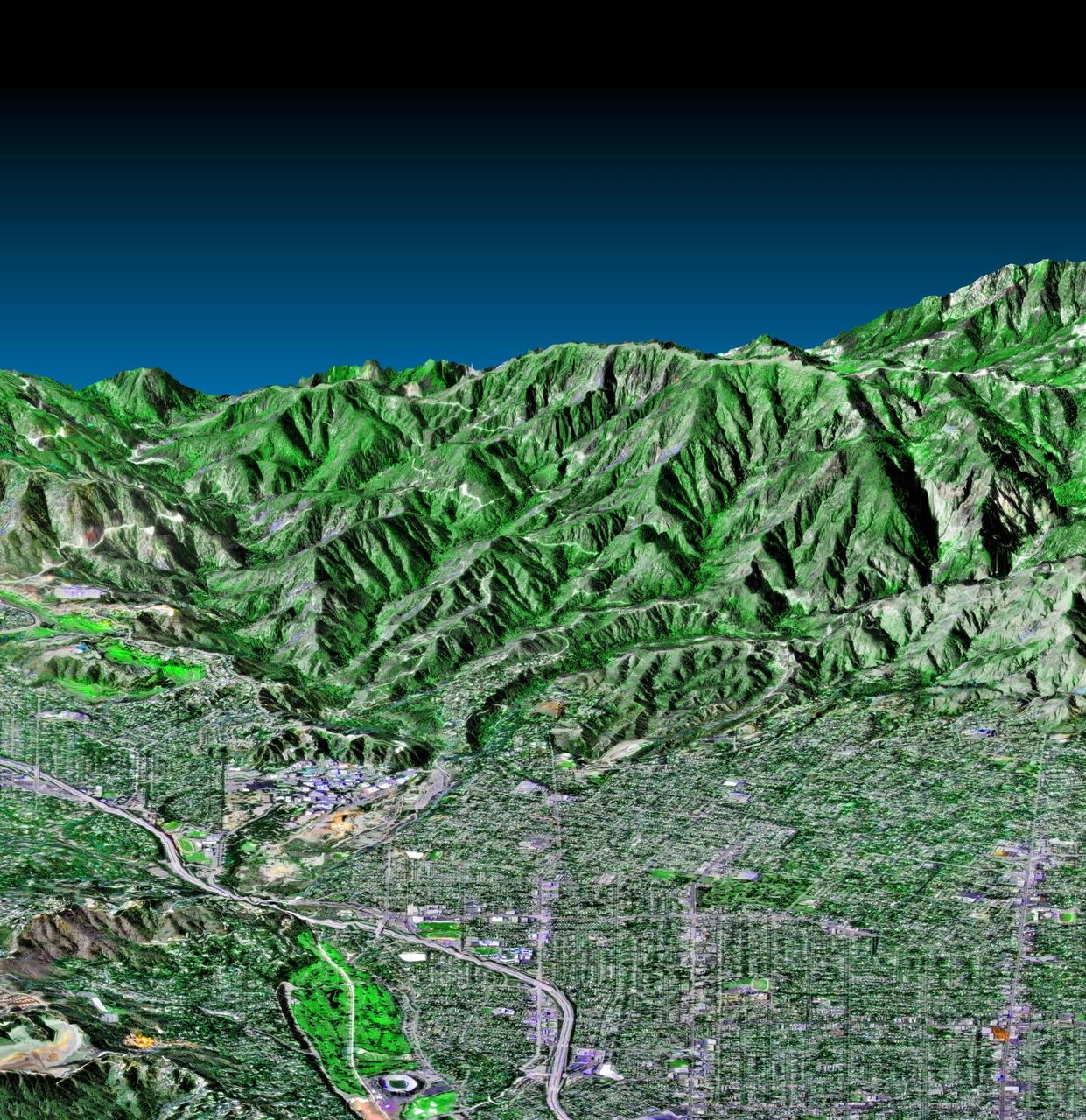 This perspective view, acquired by NASA Shuttle Radar Topography Mission SRTM in Feb. 2000, shows the western part of the city of Pasadena, California, looking north towards the San Gabriel Mountains.