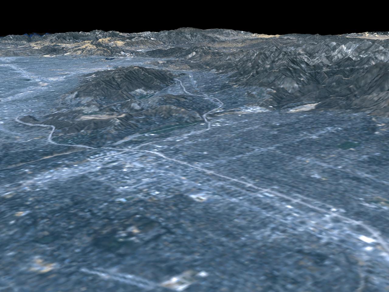 This image shows a perspective view of the area around Pasadena, California, just north of Los Angeles. The cluster of hills surrounded by freeways on the left is the Verdugo Hills, which lie between the San Gabriel Valley and the San Fernando Valley.