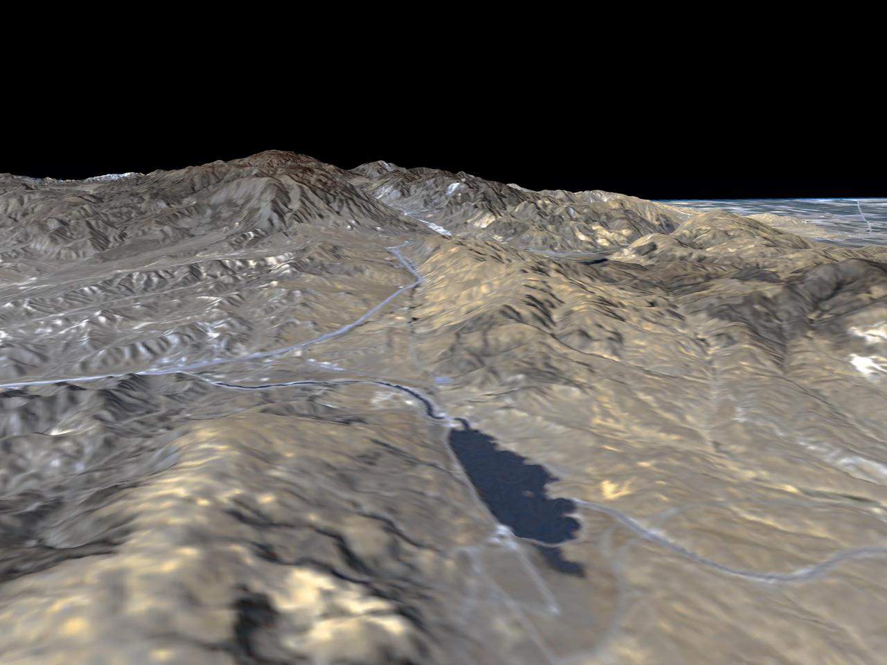 The prominent linear feature straight down the center of this perspective view is the San Andreas Fault in an image created with data from NASA shuttle Radar Topography Mission SRTM.