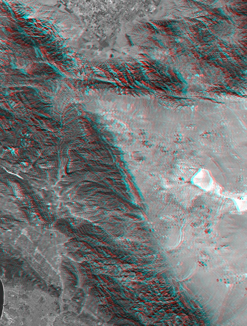 This anaglyph, from NASA Shuttle Radar Topography Mission, shows rugged terrain between Los Angeles and California central valley. 3D glasses are necessary to view this image.