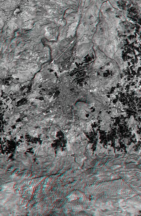 This anaglyph, from NASA Shuttle Radar Topography Mission, shows the city of Bhuj, India. 3D glasses are necessary to view this image.