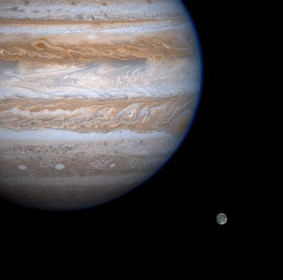 Jupiter casts a baleful eye toward the moon Ganymede in this enhanced-contrast image from NASA Cassini spacecraft.