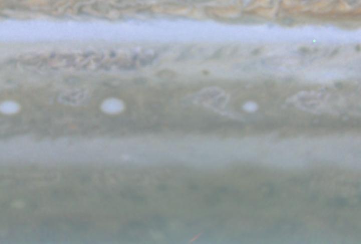 This image is a still frame, created from images taken by NASA Cassini spacecraft, shows white oval storms in Jupiter southern hemisphere that rotate counterclockwise, similar to the larger Great Red Spot. 