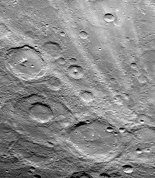 A field of bright rays, created by ejecta from a crater, radiating to the north top from off camera lower right is seen in this view of Mercury taken Sept. 21, 1974 by NASA Mariner 10. 