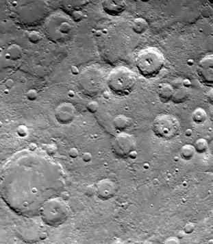 One of NASA Mariner 10 two TV cameras took this picture of a densely cratered region of Mercury on Sept. 21, 1974, 80 minutes prior to the spacecraft second close encounter with the planet. 
