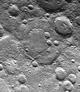 Taken about 40 minutes before NASA Mariner 10 made its close approach to Mercury on Sept. 21,1974, this picture shows a large double-ringed basin center of picture located in the planet south polar region