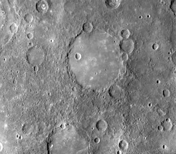 This image, from NASA Mariner 10 spacecraft which launched in 1974, shows an old basin hummocky rim is partly degraded and cratered by later events. 