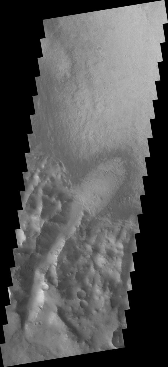This low resolution VIS image from NASA 2001 Mars Odyssey spacecraft shows a large portion of etched terrain near the south pole of Mars.