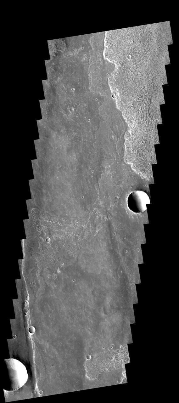 The lava flows in this image captured by NASA 2001 Mars Odyssey spacecraft are only a very small part of the voluminous lava erupted from the Arsia Mons volcano.