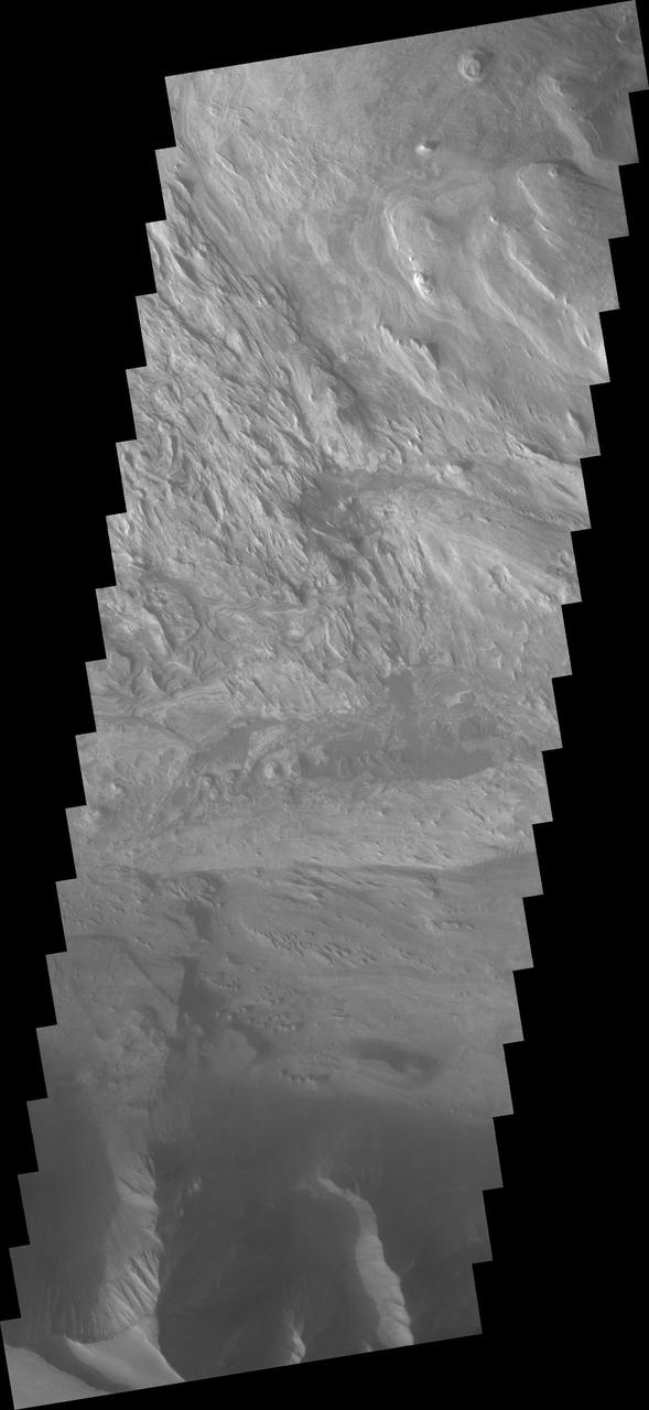 This VIS image from NASA 2001 Mars Odyssey spacecraft shows part of the layered and wind sculpted deposit that occurs on the floor of Candor Chasma.