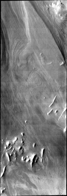 This VIS image illlustrates how distinct polar layers appear with no frost cover. This image was collected during the height of summer at the south pole of Mars by NASA 2001 Mars Odyssey spacecraft.