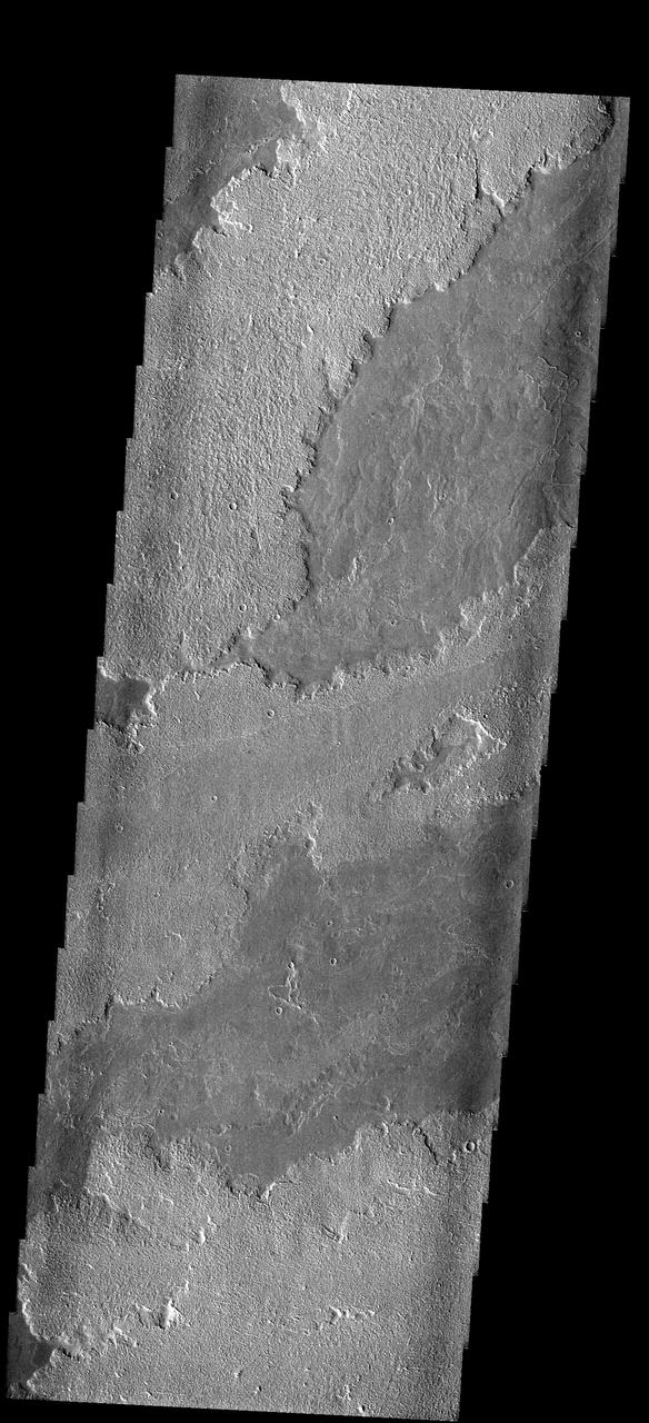 These lava flows originated at Arsia Mons. This image is from NASA 2001 Mars Odyssey spacecraft.