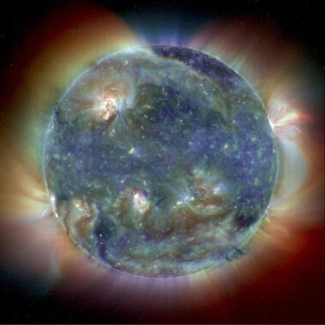 This composite image combines NASA Extreme Ultravoilet Imaging Telescope images from three wavelengths into one that reveals solar features unique to each wavelength.