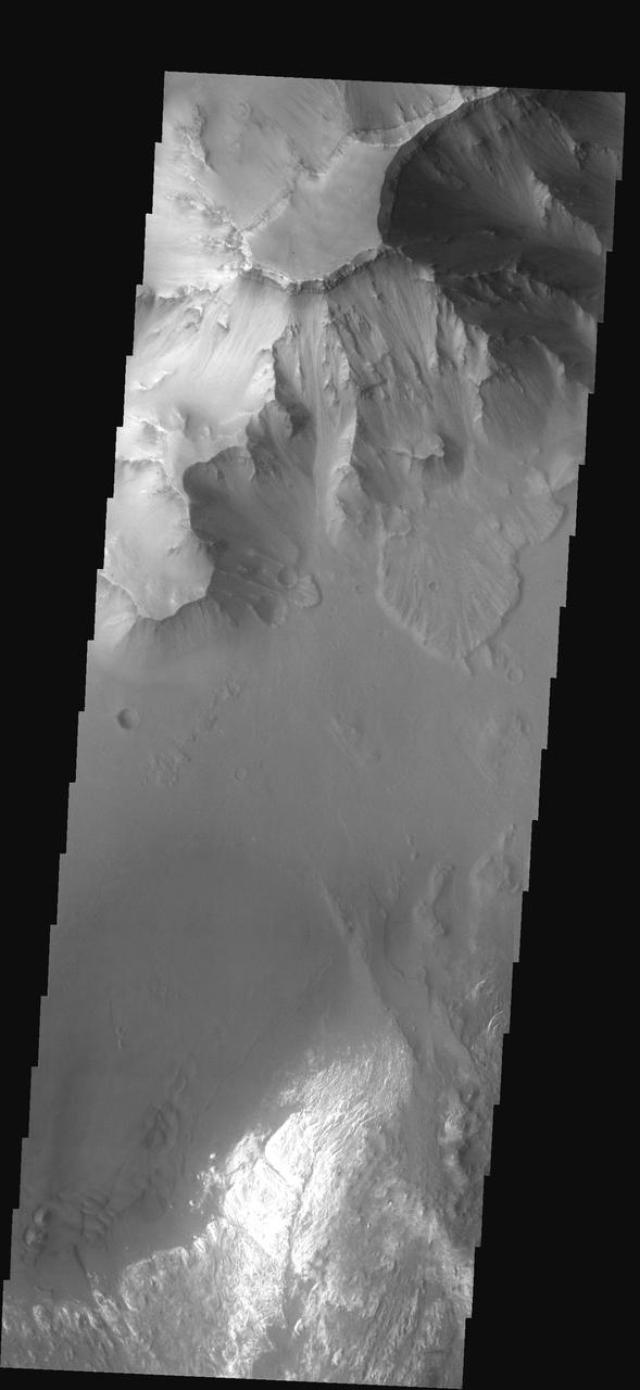 This image shows part of Ganges Chasma. Several landslides occur at the  top of the image, while dunes and canyon floor deposits are visible at  the bottom of the image