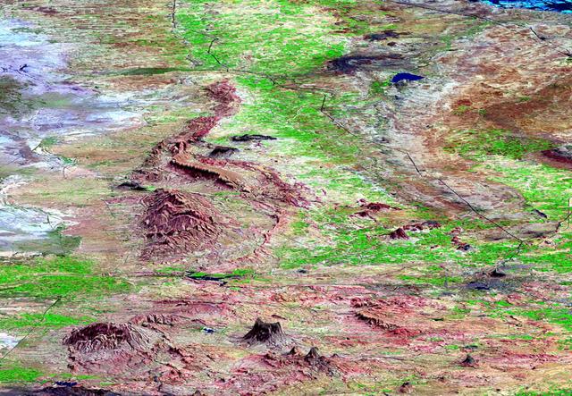This perspective view shows the city of Bhuj, India, in the foreground near the right side dark gray area. Bhuj and many other towns and cities nearby were almost completely destroyed by the January 26, 2001, earthquake in western India.