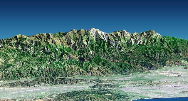 Mount San Antonio more commonly known as Mount Baldy crowns the San Gabriel Mountains northeast of Los Angeles in this computer-generated east-northeast perspective viewed from above the Malibu coastline.