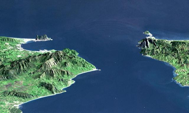 This perspective view shows the Strait of Gibraltar, which is the entrance to the Mediterranean Sea from the Atlantic Ocean. Europe (Spain) is on the left. Africa (Morocco) is on the right. The Rock of Gibraltar, administered by Great Britain, is the peninsula in the back left.  The Strait of Gibraltar is the only natural gap in the topographic barriers that separate the Mediterranean Sea from the world's oceans. The Sea is about 3700 kilometers (2300 miles) long and covers about 2.5 million square kilometers (one million square miles), while the Strait is only about 13 kilometers (8 miles) wide. Sediment samples from the bottom of the Mediterranean Sea that include evaporite minerals, soils, and fossil plants show that about five million years ago the Strait was topographically blocked and the Sea had evaporated into a deep basin far lower in elevation than the oceans. Consequent changes in the world's hydrologic cycle, including effects upon ocean salinity, likely led to more ice formation in polar regions and more reflection of sunlight back to space, resulting in a cooler global climate at that time. Today, topography plays a key role in our regional climate patterns. But through Earth history, topographic change, even perhaps over areas as small as 13 kilometers across, has also affected the global climate.  This image was generated from a Landsat satellite image draped over an elevation model produced by the Shuttle Radar Topography Mission (SRTM). The view is eastward with a 3-times vertical exaggeration to enhance topographic expression. Natural colors of the scene (green vegetation, blue water, brown soil, white beaches) are enhanced by image processing, inclusion of some infrared reflectance (as green) to highlight the vegetation pattern, and inclusion of shading of the elevation model to further highlight the topographic features.  Landsat has been providing visible and infrared views of the Earth since 1972. SRTM elevation data matches the 30-meter (99-feet) resolution of most Landsat images and will substantially help in analyses of the large Landsat image archive.  Elevation data used in this image was acquired by the Shuttle Radar Topography Mission (SRTM) aboard the Space Shuttle Endeavour, launched on February 11, 2000.   http://photojournal.jpl.nasa.gov/catalog/PIA03397