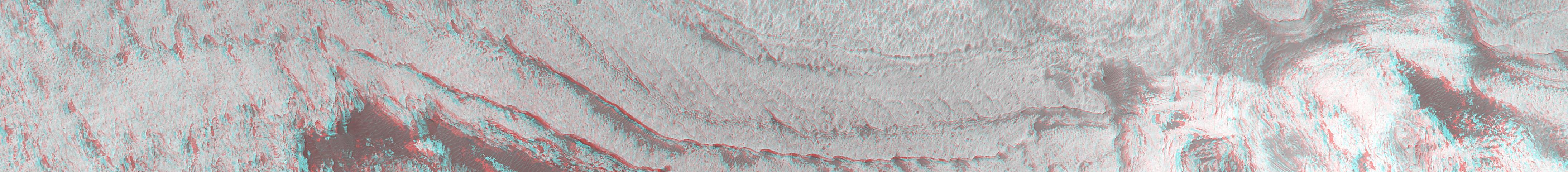 This anaglyph from NASA Mars Global Surveyor shows eroded, pitted, light-toned layer outcrops in Iani Chaos. 3D glasses are necessary to view this image.