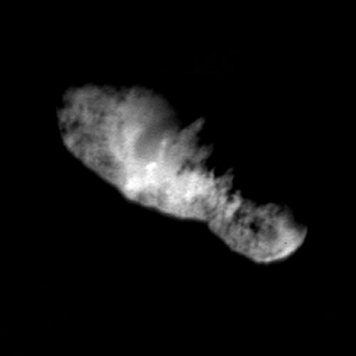 In this highest resolution view of the icy, rocky nucleus of comet Borrelly, (about 45 meters or 150 feet per pixel) a variety of terrains and surface textures, mountains and fault structures, and darkened material are visible over the nucleus's surface. This was the final image of the nucleus of comet Borrelly, taken just 160 seconds before Deep Space1's closest approach to it. This image shows the 8-km (5-mile) long nucleus about 3417 kilometers (over 2,000 miles) away.  Smooth, rolling plains containing brighter regions are present in the middle of the nucleus and seem to be the source of dust jets seen in the coma. The rugged land found at both ends of the nucleus has many high ridges along the jagged line between day and night on the comet. This rough terrain contains very dark patches that appear to be elevated compared to surrounding areas. In some places the dark material accentuates grooves and apparent faults. Stereo analysis shows the smaller end of the nucleus (lower right) is tipped toward the viewer (out of frame). Sunlight is coming from the bottom of the frame.  http://photojournal.jpl.nasa.gov/catalog/PIA03500