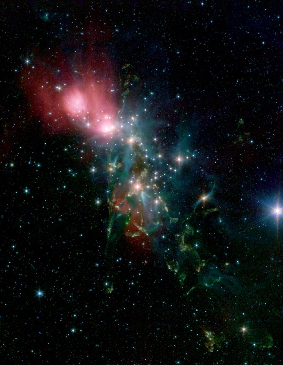 Located 1,000 light years from Earth in the constellation Perseus, a reflection nebula called NGC 1333 epitomizes the beautiful chaos of a dense group of stars being born. This image is from NASA Spitzer Space Telescope.