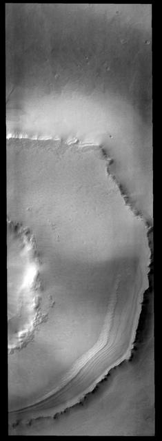 This crater is located south of Agassiz Crater. It is likely that the polar freeze/thaw/frost cycle is responsible for unusual appearance of the ejecta region around the crater