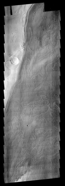 This VIS image shows part of the south polar region. The ejecta from the relatively young crater covers the rougher textured polar surface