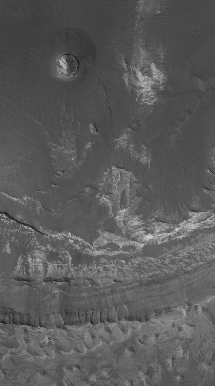 This Mars Global Surveyor MGS Mars Orbiter Camera MOC image shows light-toned, layered rock outcrops in Eos Chaos, located near the east end of the Valles Marineris trough system