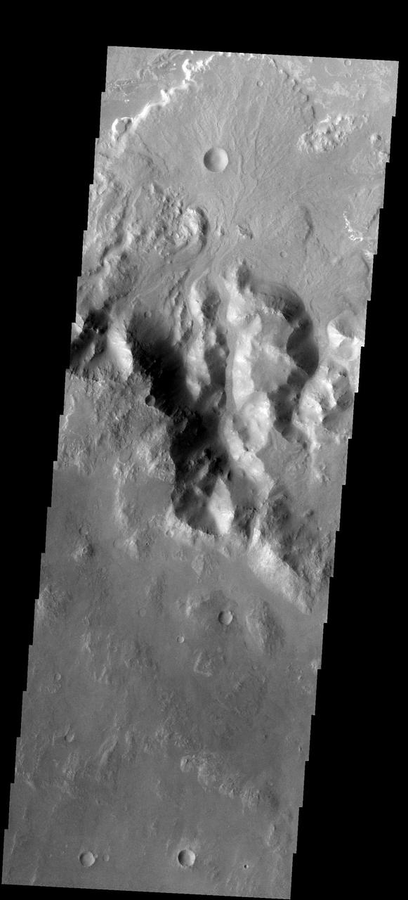 This fan-shaped delta deposit is located in Holden Crater