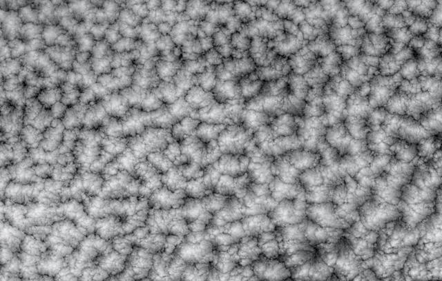 The structure of tightly packed closed cells in a layer of marine stratocumulus over the southeastern Pacific Ocean are highlighted in these views from NASA Terra satellite.