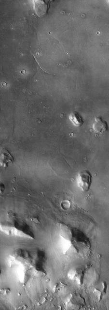 The so-called Face on Mars can be seen slightly above center and to the right in this NASA Mars Odyssey image. This 3-km long knob was first imaged by NASA Viking spacecraft in the 1970 and to some resembled a face carved into the rocks of Mars.
