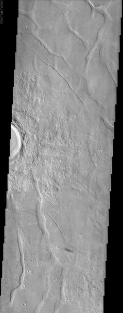 This image by NASA Mars Odyssey spacecraft shows Utopia Planitia, a large plain in the northern hemisphere of Mars. It is believed that this basin is the result of a large impact.