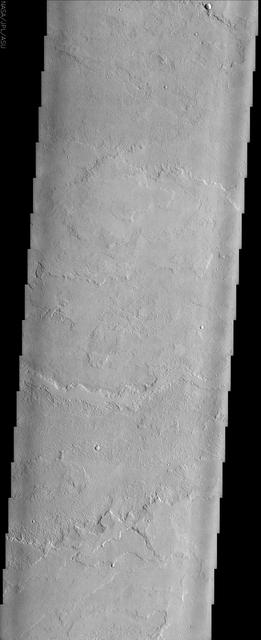 This image to the east of Tharsis Tholus from NASA Mars Odyssey spacecraft shows one of many vast fields of lava flows produced by the great Tharsis volcanoes.