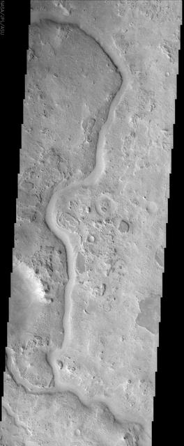 The ancient sinuous river channel shown in this image by NASA Mars Odyssey spacecraft was likely carved by water early in Mars history. Auqakuh Valles cuts through a remarkable series of rock layers that were deposited and then subsequently eroded.