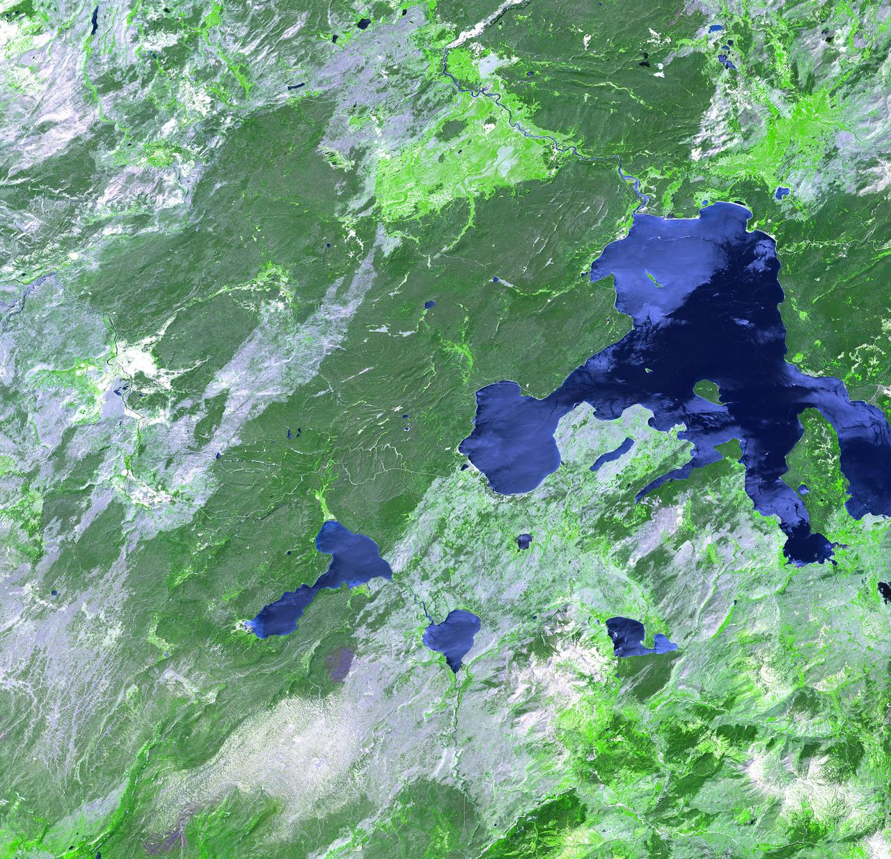 Thirteen years after devastating forest fires burned over 1.6 million acres in Yellowstone National Park, the scars are still evident. In this simulated natural color ASTER image, burned areas appear gray, in contrast to the dark green of unburned forests. The image covers an area of 60 x 63 km. This image was acquired on July 2, 2001 by the Advanced Spaceborne Thermal Emission and Reflection Radiometer (ASTER) on NASA's Terra satellite. With its 14 spectral bands from the visible to the thermal infrared wavelength region, and its high spatial resolution of 15 to 90 meters (about 50 to 300 feet), ASTER images Earth to map and monitor the changing surface of our planet.  http://photojournal.jpl.nasa.gov/catalog/PIA03875