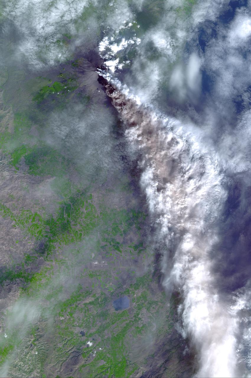 On Sunday, November 3, 2002, Mt. Etna's ash-laden plume was imaged by the Advanced Spaceborne Thermal Emission and Reflection Radiometer (ASTER) on NASA's Terra satellite. The plume is seen blowing toward the south-southeast, over the city and airport of Catania, Sicily. The previous day, the plume was blowing toward the northwest, and posed no hazard to Catania. The current eruption of Mt. Etna, Europe's most active volcano, began on October 27. These sorts of observations from space may help civil defense authorities mitigate hazards from active eruptions. Space data may also help scientists evaluate the behavior and effects volcanic eruptions have on our global climate system.  http://photojournal.jpl.nasa.gov/catalog/PIA03881