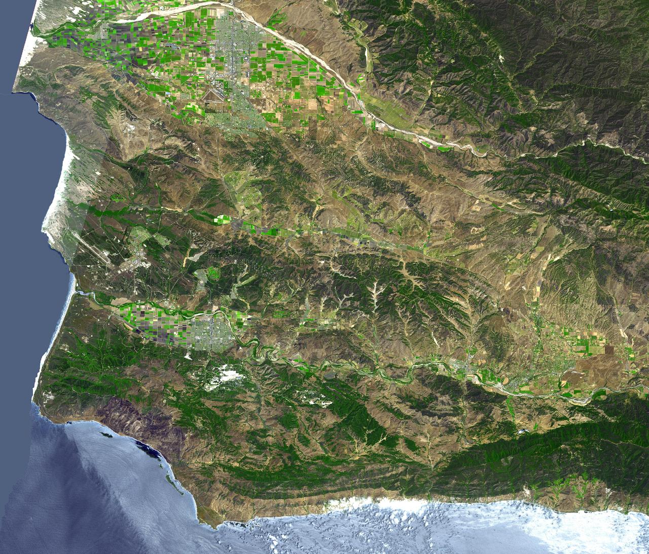 The area around Vandenberg Air Force Base, California is shown in this simulated natural color ASTER image. The city of Santa Maria is at the top left, and Lompoc is at the bottom left. Vandenberg includes the area along the coast and the prominent airport.  This image was acquired on August 31, 2001 by the Advanced Spaceborne Thermal Emission and Reflection Radiometer (ASTER) on NASA's Terra satellite. With its 14 spectral bands from the visible to the thermal infrared wavelength region, and its high spatial resolution of 15 to 90 meters (about 50 to 300 feet), ASTER images Earth to map and monitor the changing surface of our planet.  http://photojournal.jpl.nasa.gov/catalog/PIA03882