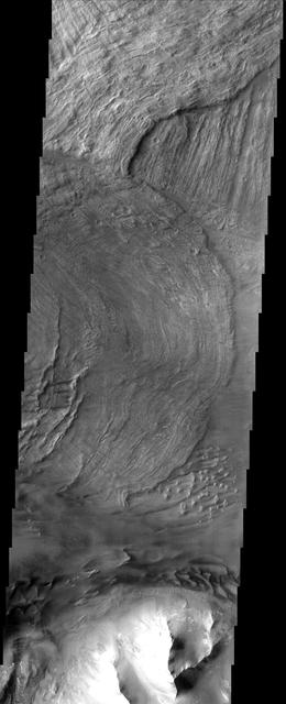 This canyon system imaged here by NASA Mars Odyssey was named Valles Marineris in honor of its discoverer, NASA Mariner 9 spacecraft. The image covers a portion of the canyon system called Melas Chasma.  http://photojournal.jpl.nasa.gov/catalog/PIA04003