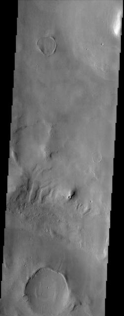 The larger craters in this image from NASA Mars Odyssey spacecraft showing a region north of Elysium Mons are buried and distorted almost beyond recognition. http://photojournal.jpl.nasa.gov/catalog/PIA04007