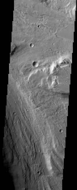 The ancient, catastrophic floods on Mars, whose origins remain a mystery, produced a channeled and scoured landscape like this one, which is called Tiu Valles and was imaged by NASA Mars Odyssey spacecraft.  http://photojournal.jpl.nasa.gov/catalog/PIA04013