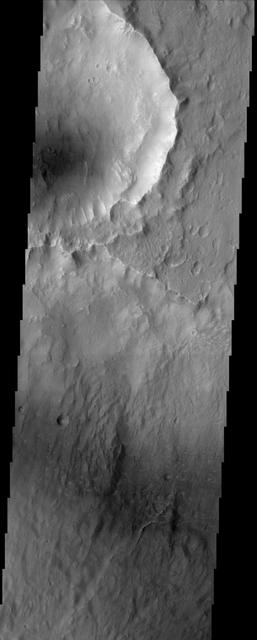Except for the loss of its ring of ejecta, the crater at the leading edge of this streamlined island in Kasei Vallis, imaged here by NASA Mars Odyssey, shows no hint of the catastrophic floods that passed by it. Kasei Vallis is one of several major outflow channel systems that were active over 3 billion years ago. The intense floods scoured the landscape, eroding craters and producing streamlined islands. But in a close-up view, the evidence for these floods is not apparent. This true of the most similar terrestrial example, the channeled scablands of eastern Washington which also were formed by a catastrophic flood.  http://photojournal.jpl.nasa.gov/catalog/PIA04022