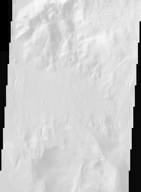 Perched on the northern rim of the enormous Hellas Basin, Terby Crater, imaged by NASA Mars Odyssey, is host to an impressive range of landforms. As is common for many Martian craters, Terby has been filled with layered material, presumably sediments. The process of erosion has exposed some of these layers along with strange, rectilinear ridges. Sinuous channels, collapse pits, and a scoured-looking cap rock are some of the other interesting landforms in Terby. Such a variety of landforms attests to a diversity of rock types and geologic processes in the relatively small area of this THEMIS image.  http://photojournal.jpl.nasa.gov/catalog/PIA04024