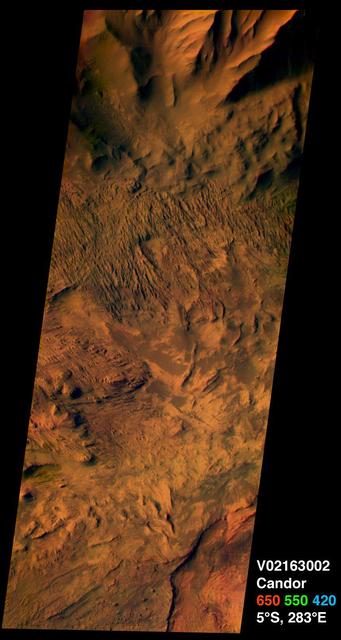 This image from NASA Mars Odyssey spacecraft was acquired of Candor Chasma within Valles Marineris and shows the effects of erosion on a sequence of dramatically layered rocks.