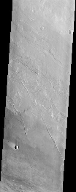 This image from NASA Mars Odyssey of lava flows around the large scarp of Olympus Mons reveals textures characteristic of the variable surface roughness associated with different lava flows in this region.